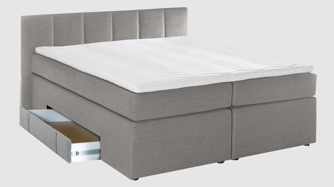 Platzsparendes Boxspringbett mit niedrigem Kopfteil